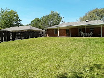 The Lawn Care Guys logo